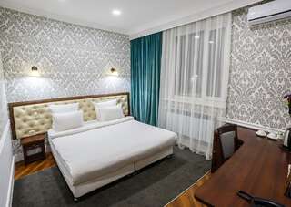 Отель Brown Hotel Нур-Султан Улучшенный двухместный номер с 1 кроватью или 2 отдельными кроватями-1